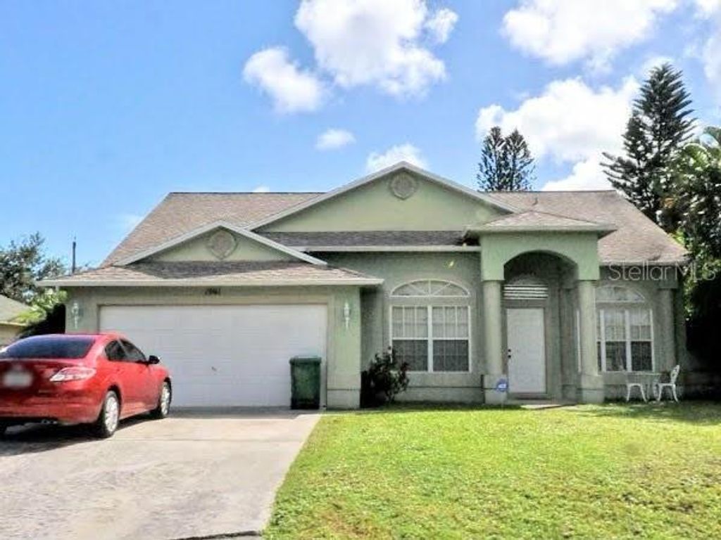 Photo of 1961 SE Doverbrook Street, Port Saint Lucie, FL 34983 (MLS # R10795441)