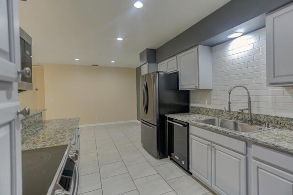 Photo of 140 Date Palm Drive, Lake Park, FL 33403 (MLS # R10909126)