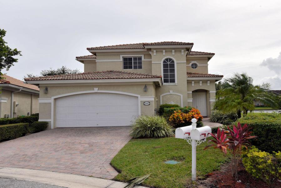 Enjoy the Florida lifestyle in this 3 bedroom 2.5 and 2 car garage home located in desirable Andros Isles on a private cul-de-sac with over sized lot. This is a pet friendly community. In this home you will find large rooms and water view from each window also open concept kitchen. The community features a clubhouse with kitchen and community room which you can reserve for private parties, tennis courts, Olympic-size pool, fitness center, and billiards room. This home also includes gated guardhouse, basic cable. Near schools, airport, just minutes away from City Place or wellington.