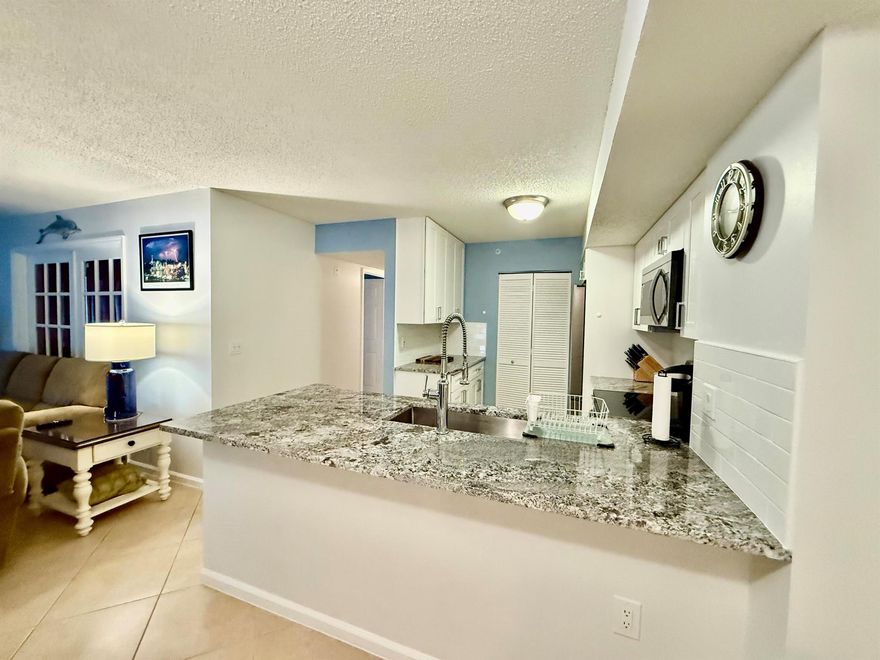 Welcome to 284 Village Boulevard #9102, a beautifully furnished first-floor condo offering three bedrooms and two bathrooms in the highly desirable Village community of Tequesta. This bright and spacious home features an open-concept floor plan, tasteful coastal decor, a well-equipped kitchen, and the convenience of an in-unit washer and dryer. Move-in ready and available as a short-term rental through January 2026. Located in the heart of Tequesta, this property places you close to everything that makes this coastal village so special. Enjoy nearby Jupiter and Juno beaches, the Loxahatchee River, and the Intracoastal Waterway--all just minutes away.