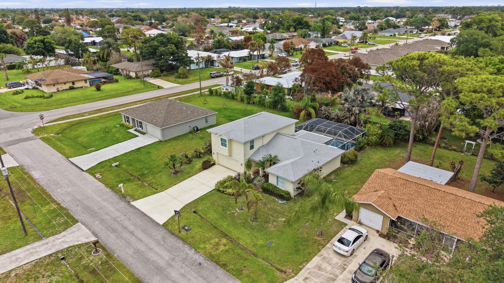 Photo of 1707 SE Manth Lane, Port Saint Lucie, FL 34983 (MLS # B26017917)