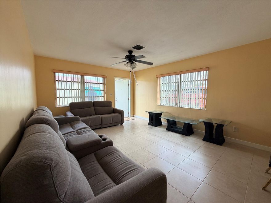 Bright and spacious 2-bedroom, 1-bathroom apartment featuring tile flooring throughout and plenty of natural light. Enjoy a large living area perfect for relaxing or entertaining, plus a roomy kitchen with ample cabinet space and a convenient breakfast bar. Both bedrooms offer generous space and great closet storage. Located in a quiet residential setting with easy access to shopping, dining, and major highways. Comfortable, clean, and move-in ready—this one won’t last long!