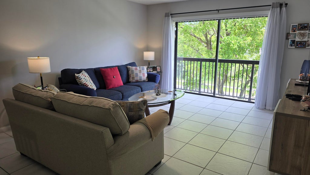 Photo of 4965 E SABAL PALM Boulevard #403, Tamarac, FL 33319 (MLS # B26053391)