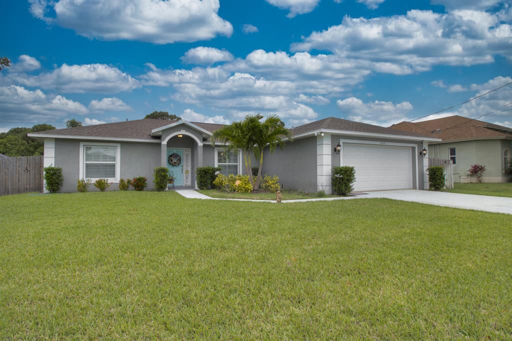 Photo of 5774 NW Zinnia Street, Port Saint Lucie, FL 34986 (MLS # R10710359)