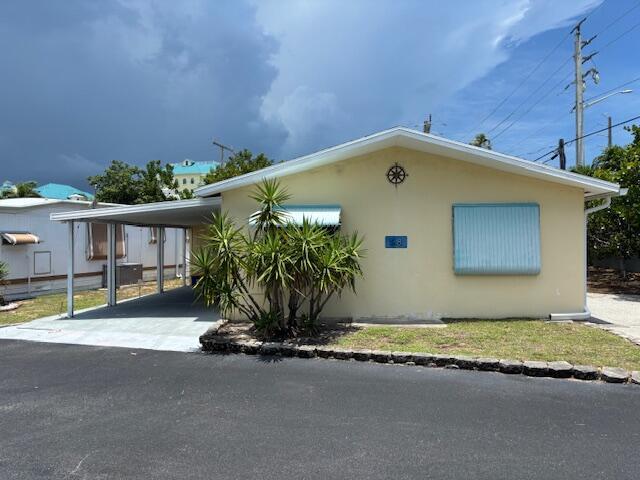 Over 55 community! - this CBS 3/2 home is walking distance to Juno Beach and Pier!It is set up as a main home and efficiency, but must be rented as one property. Walk into a large open space to the kitchen, living room, and dining area - all with tile floors, and inside laundry. Attached efficiency has a sperate entrance, but can also be accessed through main home.There is plenty of parking with a carport on the west, and additional parking to the east. Assoc. has a club house, shuffleboard, and and bocce ball court. One cat or dog less than 20 lbs.