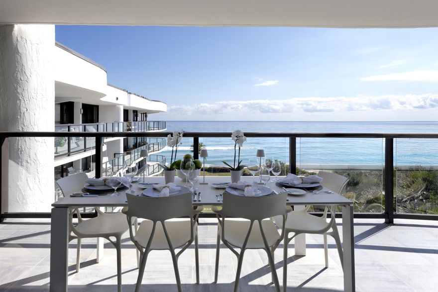 Fully furnished and equipped, this penthouse oceanfront residence offers rare east-to-west exposure with direct water views from both sides, featuring unobstructed sunrise views over the Atlantic and breathtaking sunset views over the Intracoastal—no buildings across the street, just water and sky from every angle. The 2-bedroom, 2-bathroom home spans 1,886 square feet under air (2,450 total) and features expansive balconies on both sides, each over 50 feet long and up to 8.5 feet deep, creating seamless indoor-outdoor living directly on the beach. • Sub-Zero Refrigeration and Freezer Towers, Wine Refrigerator... • Custom Polished Nickel Dining Room Built-in Cabinet by SieMatic • Custom paneling throughout by SieMatic • White Glass Top Porcelain Floors Throughout • Polished nickel faucets and fixtures throughout by Franz Viegener • Master Bedroom Custom Sconces and Guest Bedroom Chandelier and Sconces all by Lobmeyr, Vienna...collector quality • Sonos soundbars mounted under credenzas in bedrooms • Entire Bespoke Dressing Room is fully glazed (glass front cabinetry) • Floating Beds both by Daniele Lago, Italy...underlit by SieMatic • Primary Bath has Two-Person Walk-in Shower with Starphire Glass Panels And A Soaking Tub  • Guest Bath has Sonneman lighting and Starphire Glass Shower   Enclosure  Fully Furnished and Equipped Includes:  • 2 restored curved sofas by Vladimir Kagan in Metaphores Paris White Boucle • Custom KravetCouture Pillows • Custom Starphire Glass Dining Table Seats 10 • Custom Lucite Upholstered Dining Chairs, Set 8 • Custom Starphire Glass Cocktail Table • Custom Lucite Floating Poufs, 2 • Haviland Fine China, Custom Order, Set for 8 • Christofle Acier Flatware, Set for 10 • All-Clad Chefs Selection of Cookware • Top Quality Kitchen Accessories • Full Bar: Stemware by Spiegelau, wine accessories • New Dyson Vacuum Cleaner • Tabletop: placemats, linens • Bed: Linens by Frette, Primary Bed Mattress by Duxiana • Bath: Towels, Bath Mats by Pottery Barn • Master Bedroom Lamps Signed Romeo Rega, Skyscraper, Rare pair in polished nickel, 1970's, collector quality • Guest Bedroom Lamps Signed Romeo Rega, Halston Era, Rare pair in Lucite, Polished Nickel and Stainless   All artwork and pedestals are available for sale.