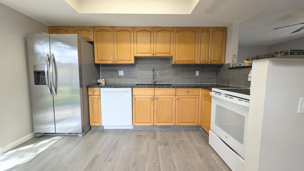 Photo of 9062 W Highland Pines Boulevard, Palm Beach Gardens, FL 33418 (MLS # R11159179)