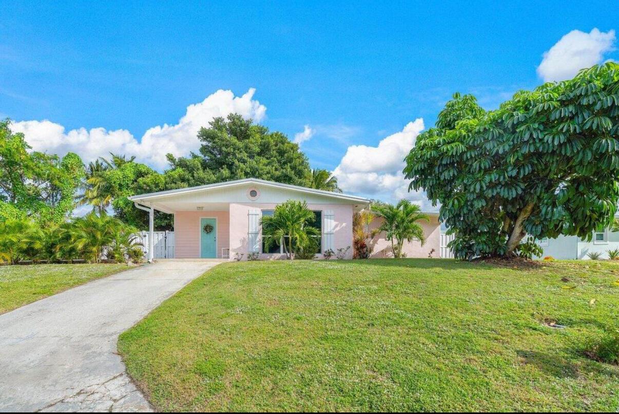 This charming three-bedroom, one-bathroom home is nestled in a tranquil neighborhood just one block from Indian River Drive and Indian Riverside Park! The single-level home with metal roof sits high on the ridge on a quiet dead-end street. It boasts a large, fenced-in backyard with a sprinkler system and an inviting swimming pool, perfect for outdoor gatherings and relaxation. Inside, the open-concept floor plan offers tile and terrazzo flooring throughout, and a spacious living area with floor-to-ceiling impact windows that bring in natural light. The kitchen boasts beautiful solid maple cabinetry with tons of storage space, a cozy breakfast bar, granite countertops, stainless steel appliances, and recessed lighting. Landlord pays all utilities and monthly maintenance fees(lawn & pool).
