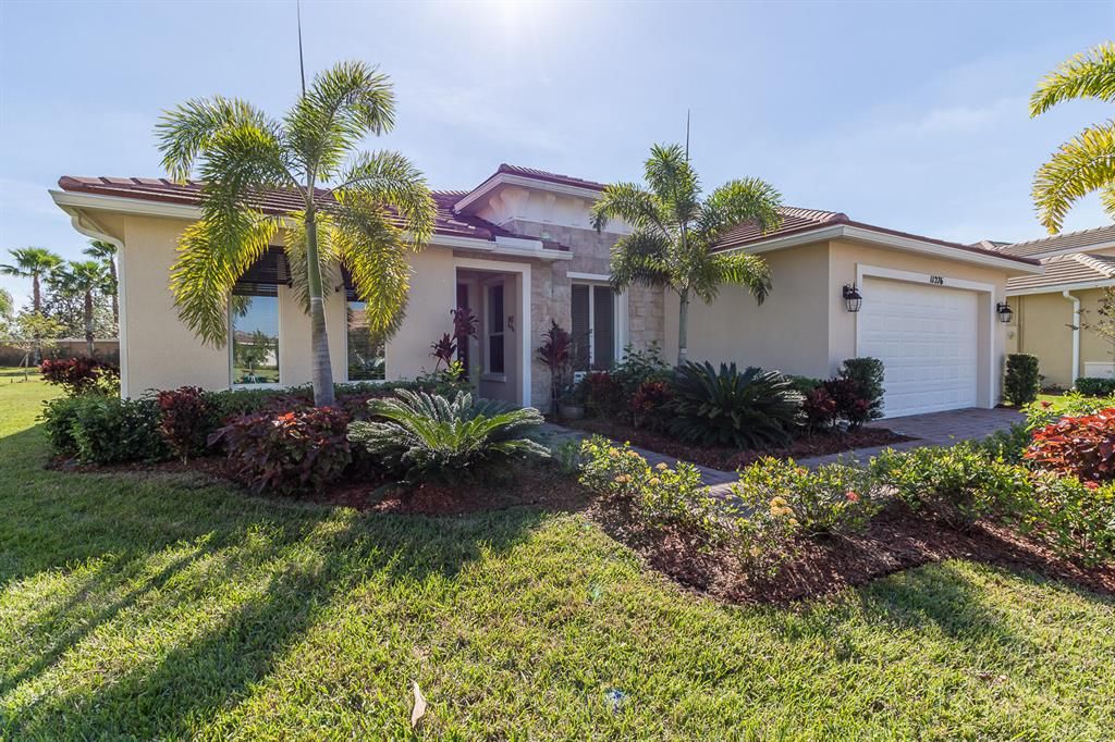 Photo of 11276 SW Apple Blossom Trail, Port Saint Lucie, FL 34987 (MLS # R10723216)
