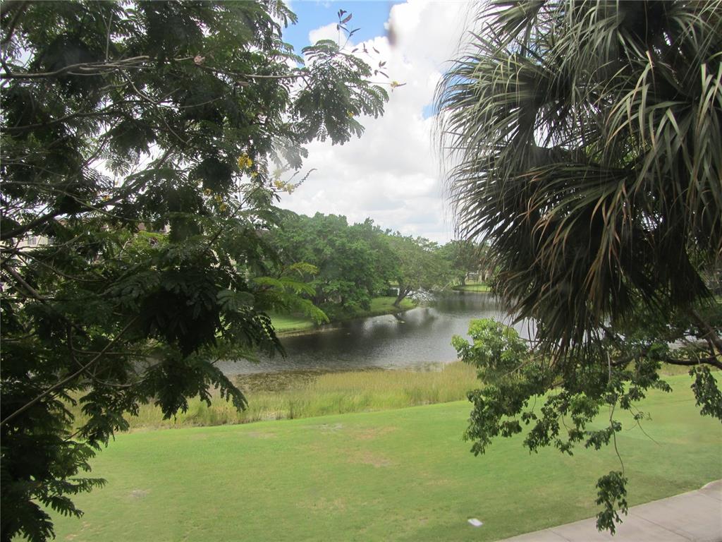 This lovely unit is updated and in mint condition. Impact windows. Laundry room large enough to be an office as well. Spacious floorplan. Private country club community included in maintenance fee. Pool and clubhouse within Whitehall 2 plus 2 country club restaurants, gym, olympic pool, tennis, near to Nova University, Publix and retail shopping, minutes to I595.