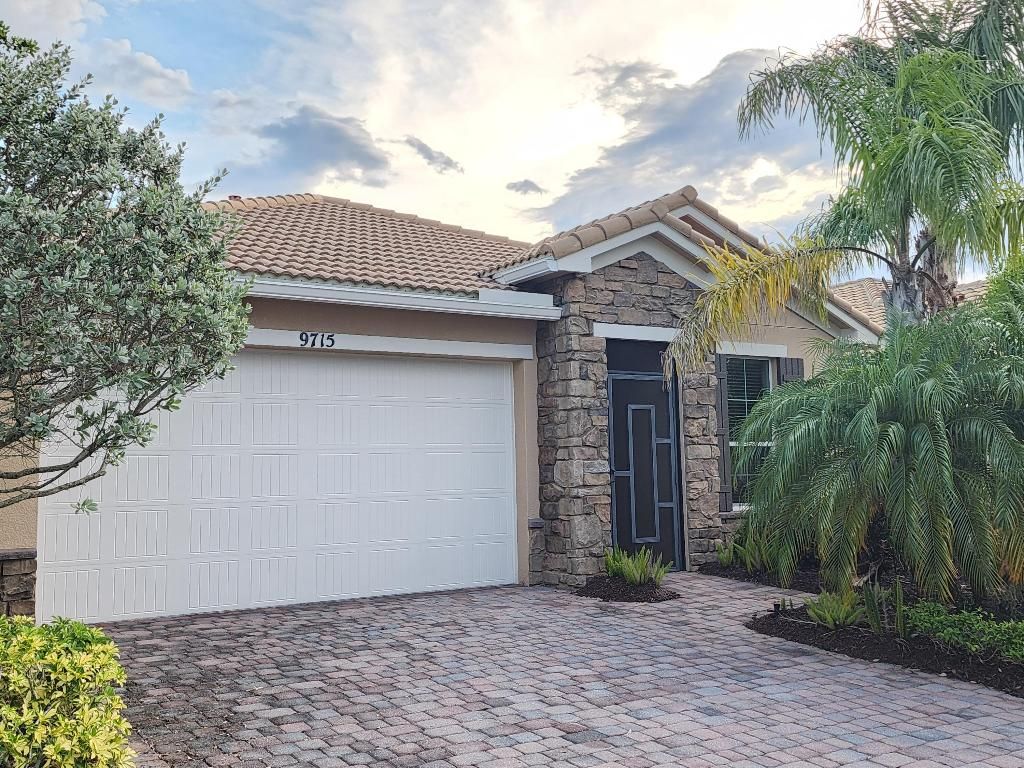 Photo of 9715 SW Royal Poinciana Drive, Port Saint Lucie, FL 34987 (MLS # R10996986)