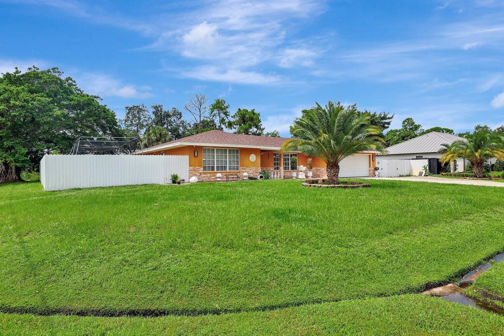 Photo of 499 SE Calmoso Drive, Port Saint Lucie, FL 34983 (MLS # R11010822)