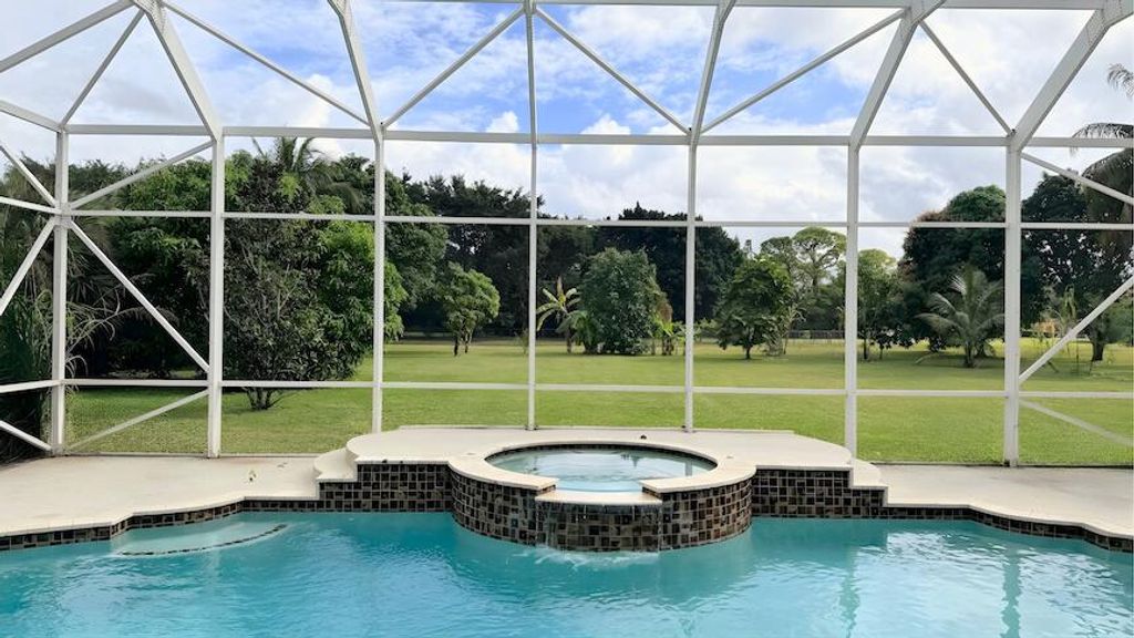 Photo of 8480 Man O War Road, Palm Beach Gardens, FL 33418 (MLS # R11155018)