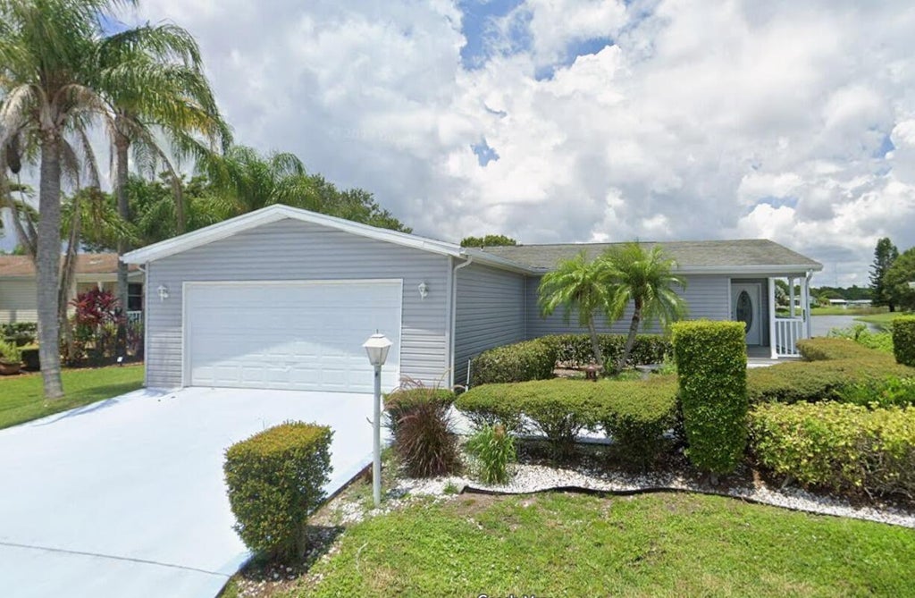 Photo of 8027 9TH HOLE Drive, Port Saint Lucie, FL 34952 (MLS # B26088617)