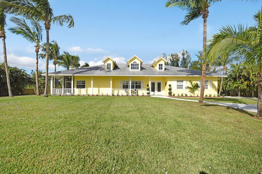 Charming Key West style 4bed/2bath/2car garage w/ in Jupiter Farms on 1.25 acres of land is a gem.  This home offers a formal living area, family area, updated kitchen with granite and upgraded Fridgidaire ''Gallery Collection''appliances, porcelain plank tiles and large white custom plantation shutters throughout home to give it that beachy feel. Spacious master bedroom with his and her closets and sinks and updated bathroom. Split floor plan with split a/c systems and three bedrooms on the other side of home. Cabana bathroom that leads out to the screened in patio area, large heated pool, and magnificent backyard for entertaining or relaxing near your concrete fire pit. bathroom. Split floor plan with split a/c systems and three bedrooms on the other side of home. Cabana bathroom that leads out to the screened in patio area, large heated pool, and magnificent backyard for entertaining or relaxing near your concrete fire pit.  Two car attached garage and a large detached garage that can store all your cars, boats, atvs, or be used for a workshop. This is the perfect home for horse owners, just at the end of the street is the C18 Canal which connects right into Riverbend Park for horseriding. This well manicured home wont last long! OPEN HOUSE SUNDAY DEC 10TH 12-4