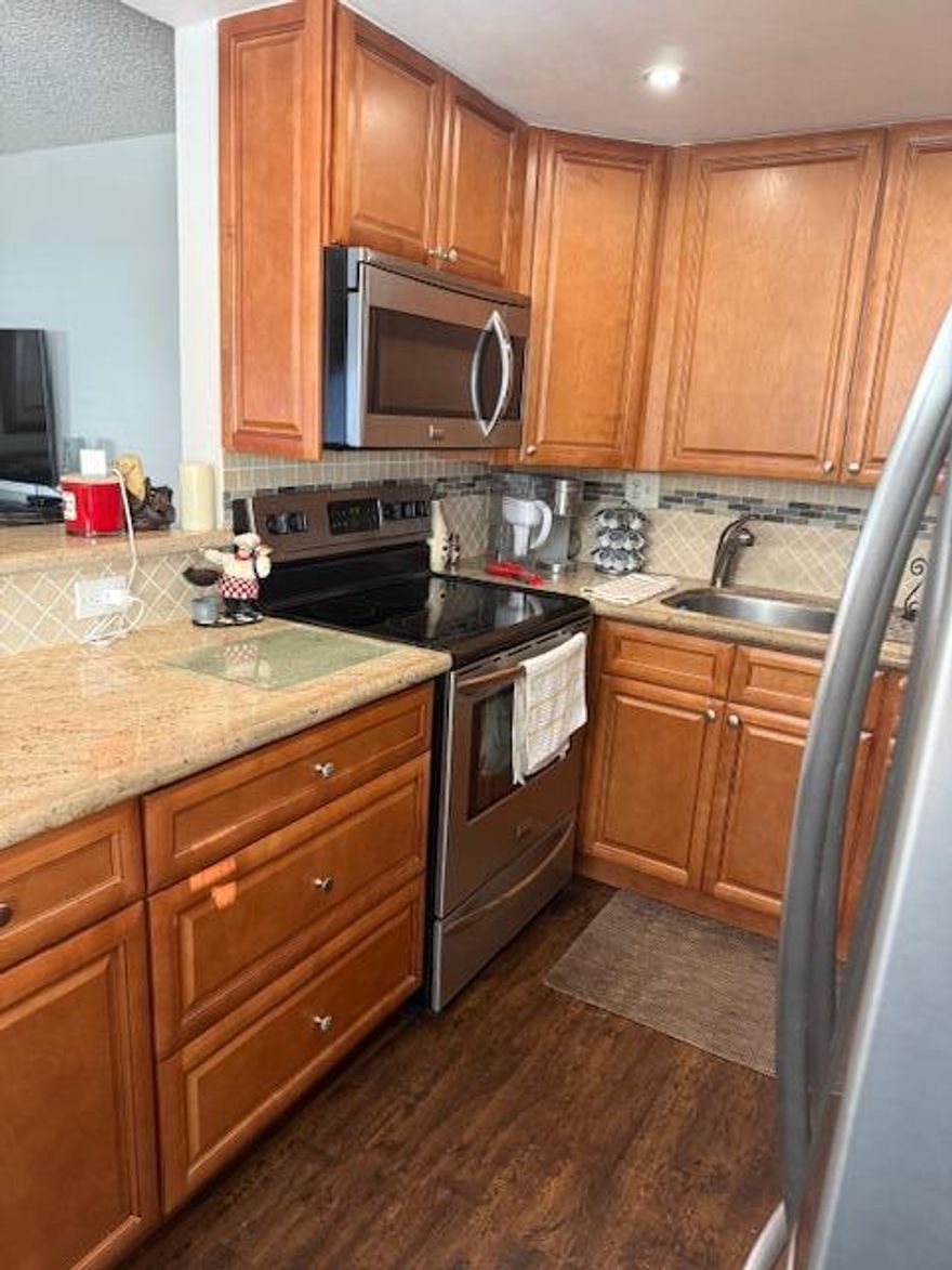 Beautiful 2-2 first floor unit, Wood cabinets, granite, stainless steel appliances open kitchen, vinyl flooring, Impact windows.  2 full baths. Roof 11/2019, water tank 5 yr. Sit on patio and enjoy your own private area, plants and flowers facing the lake your private oasis and watch the sun set. Close to Flanders club house. Kings Point has Buses, Theater, 2 Golf courses, 2 Restaurant, pickleball, tennis, gym, indoor pool so much more.