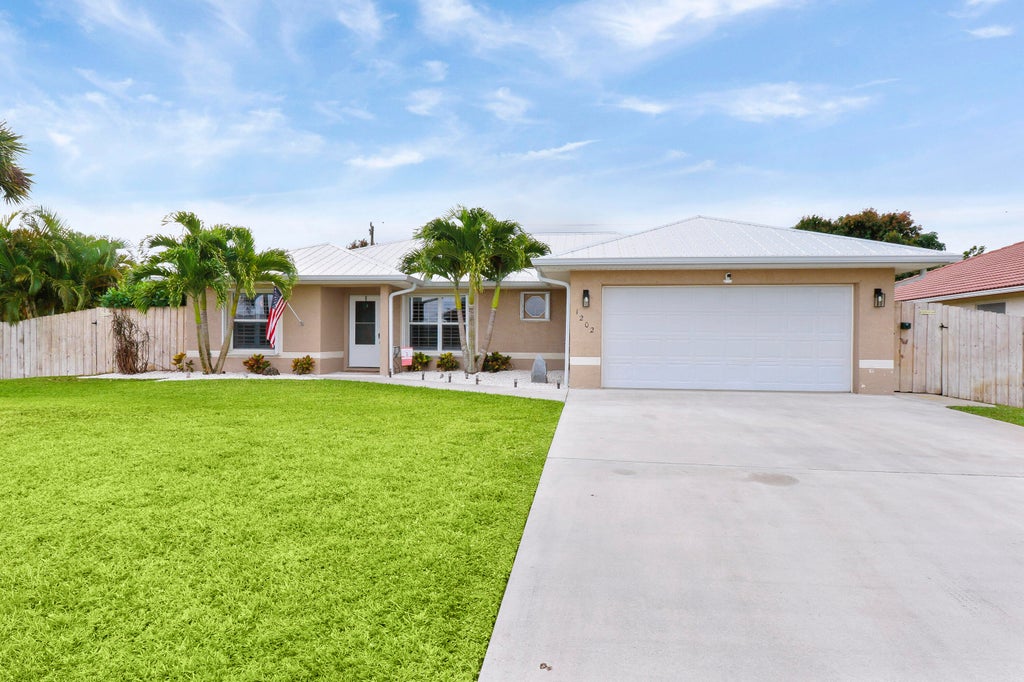 Photo of 1202 SW Lawndale Avenue, Port Saint Lucie, FL 34953 (MLS # R10966481)