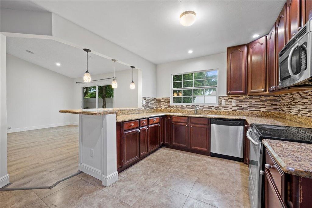 Photo of 4193 Willowood Lane, Lake Worth, FL 33462 (MLS # R10932156)