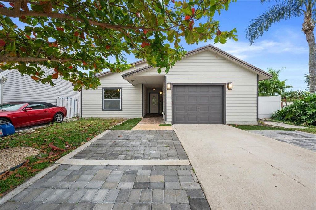 Photo of 4193 Willowood Lane, Lake Worth, FL 33462 (MLS # R10932156)