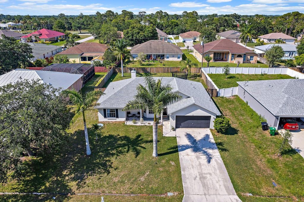 Photo of 1433 SW Flounder Lane, Port Saint Lucie, FL 34953 (MLS # R11090219)