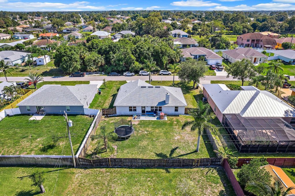 Photo of 1433 SW Flounder Lane, Port Saint Lucie, FL 34953 (MLS # R11090219)