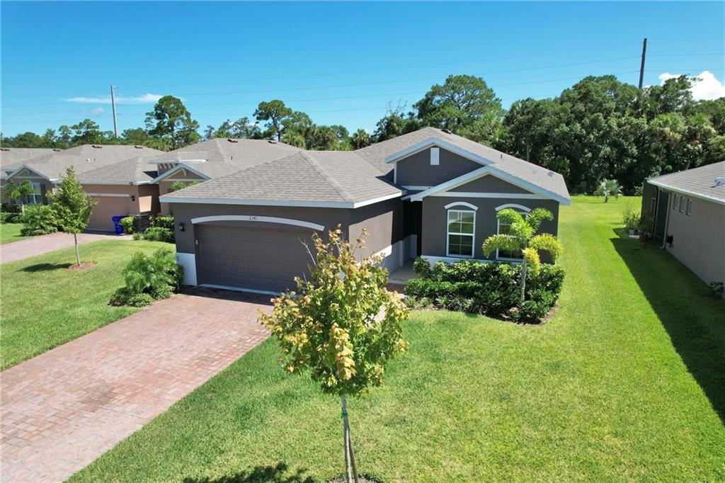Your Florida Lifestyle Awaits! Welcome to the home you're dreaming of--this beautifully maintained 2023 CBS has 3 bdrms, 2 baths & 2-car garage. Perfectly situated in expansive, private backyard--w/plenty of room for a pool--this space is ideal for entertaining, gardening, or to simply relax under the FL sunshine. Inside, the open-concept design creates a seamless flow between the living, dining, & kitchen areas, making it easy to gather w/friends & family. The chef's kitchen features white cabinetry, SS appliances, a generous center island, granite countertops, & a large pantry. The split-bdrm layout offers privacy for guests, while the spacious primary suite boasts a walk-in closet & double sinks. Enjoy the community pool & cabanas. Low HOA includes landscaping. rmszappr&sub2err