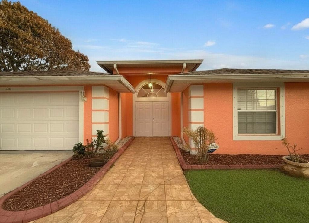 Photo of 430 SE Thanksgiving Avenue, Port Saint Lucie, FL 34984 (MLS # B26003416)