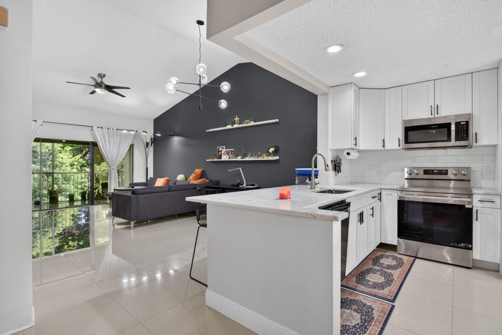 Photo of 4111 NW 22ND Street #250E, Coconut Creek, FL 33066 (MLS # B26069115)