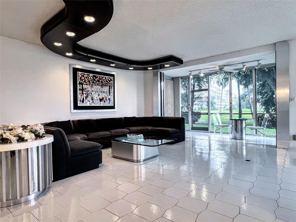 Photo of 800 Cypress Grove Dr #106, Pompano Beach, FL 33069 (MLS # F10540567)