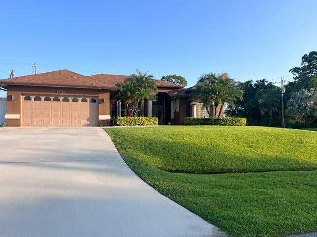 Photo of 1702 SW Comfort Street, Port Saint Lucie, FL 34987 (MLS # B26044947)