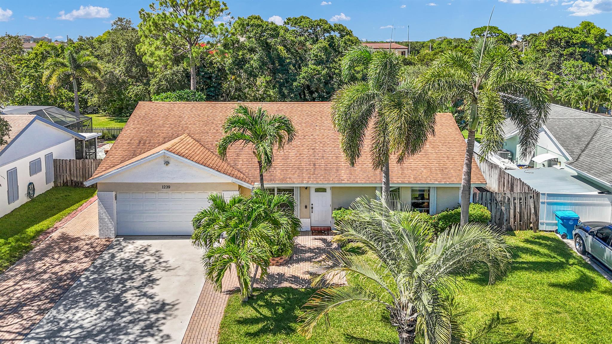 Welcome to this Beautifully Updated 4 Bed, 2 Bath, 2 Car Garage home situated on The C. Stanley Weaver Canal with a Private Dock! Inside you will find a Freshly Painted open floorplan, Vaulted Ceilings, with recently Updated Kitchen and Baths (2025). Tiled throughout, this move-in ready home offers peace of mind with Whole House Accordion Hurricane Shutters, Roof, (2017), AC (2017) Hot water Heater (2020). Step outside to a Huge Screened in Lanai perfect for Entertaining or Relaxing with plenty of room to add a pool. The property is fully irrigated with FREE water from the canal. Driveway parks up to 6 vehicles with add'l pads for boats and/or RV's. Walking distance to Dining, Shopping & Entertainment! 2.5 Miles from the Beach! Bring your Toys and Enjoy what South Florida has to offer!