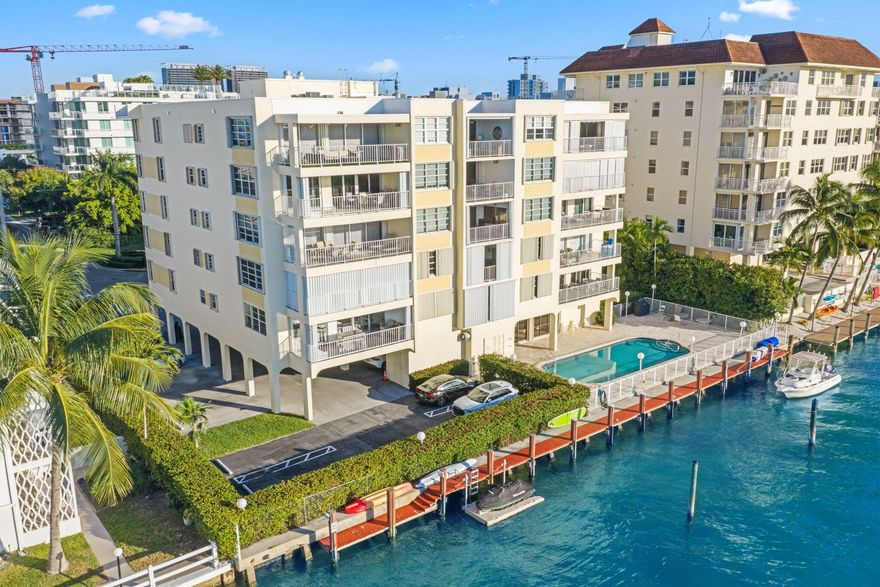 This beautifully remodeled 2BR/2.5BA corner condo offers 2,045 SF of light-filled waterfront living with direct intracoastal views. Featuring impact windows, abundant natural light, a spacious split floor plan, and a large balcony, this home is designed for comfort and elegance. The oversized primary suite includes two walk-in closets and an en suite bath, while the generous guest suite also features a walk-in closet, and en suite making it feel like a second primary. Includes 2 parking spaces, a boat slip available for rent (up to 33') Dock space pricing in broker remarks. Building that has already completed its 50-year certification. Located in the heart of Bay Harbor Islands, you're just moments from Bal Harbour Shops, Surfside, beaches, top-rated schools, dining, and houses of worship