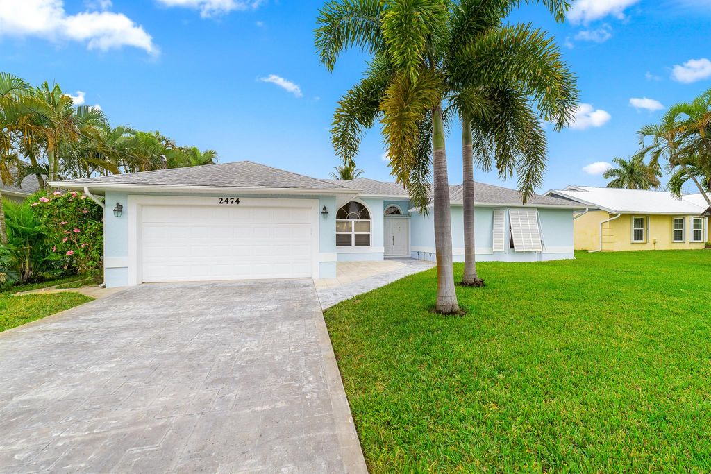 Photo of 2474 SE Marius Street, Port Saint Lucie, FL 34952 (MLS # R10953851)