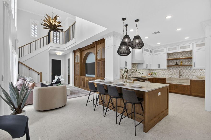 PROFESSIONAL PHOTOS TOMORROW! Interior-designed, 3 bedroom courtyard home set on the coveted Stoney Green in gated community. Prepare to be wowed by this TURNKEY, newly landscaped and painted home where every interior inch has been meticulously renovated to reflect a transitional, Palm Beach aesthetic with shades of mid-century magnificence. Bespoke, handcrafted wood kitchen features Taj Mahal quartzite, marble backsplash, brass hardware and custom hood. Hand-crafted, built-ins throughout home, including entertainment center, bar, beverage station and walk-in closets. Four new, stunning bathrooms. Italian porcelain floors throughout, including the parquet-look upstairs. New, elegant wood staircase and all new top-line appliances. Designer mirrors, light-fixtures and smart accessories.  Accordion shutters installed for peace of mind. Primary can be upstairs or downstairs. High ceilings, all custom window treatments and lots of natural light makes this a joyful pied-a-terre, a primary home or a winter investment. Close to everything, including gate access, club and walking/bike trails.   Evergrene offers resort amenities such as a community pool, casual eatery, pickleball courts, basketball, nature trails, gym and so much more. It is a recognized Audubon community and it is centrally located to all Palm Beach has to offer.