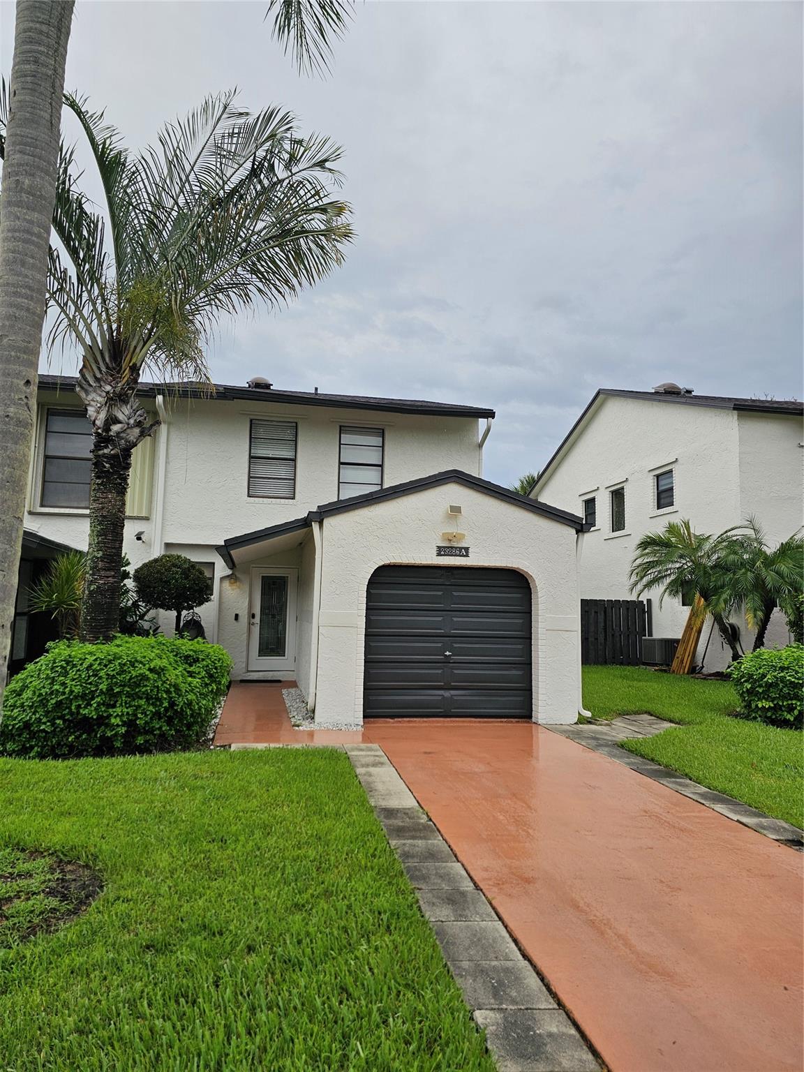 Remodeled 3 bed 2.5 bath corner unit townhome (garage converted to 4th bed/office can easily return to operating garage). Quiet community conveniently located just off 18th St West Boca. 2 story w screened porch. Downstairs tile floors, LED lighting & gourmet kitchen. Ideal first time home or growing family. Roof 2016. Tankless water heater. AC 2009. Washer / Dryer inside. Saturnia tile downstairs, rich chocolate engineered floor upstairs. Kitchen and 3 baths remodeled. Attractive front impact door. Primary bedroom w volume ceiling and walk in closet. Checks all the boxes, great first home. Community clubhouse, pool, tennis, cable, landscaping /lawn maint, trash included w HOA. Attached garage, private driveway and guest parking. All ages. Fee simple townhome. 2 pets 35 lbs.