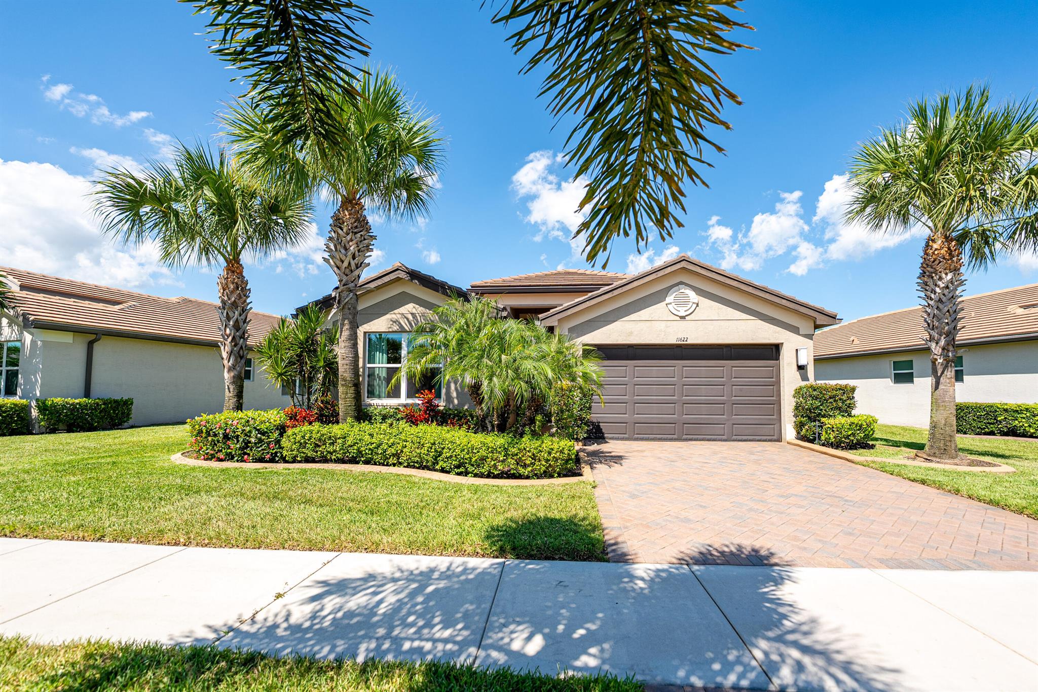 Luxury living in Valencia Cay. This home is a Heron model, with two bedrooms and two baths, a flex / office / third bedroom, with two panel wood doors , and with dozens of beautiful and sophisticated upgrades in all rooms. It is serene, and plenty of light brightens it. The view of the lake from the patio, the living room and kitchen, and from the master bedroom is unobstructed. There are electric remote shades throughout the home. The gourmet kitchen meets the needs of every chef, with custom built cabinets and pantry with pull-outs, an ample island, and soft closing cabinets and drawers, which are also found in both baths.The two bathrooms have floor to ceiling tiles and glass enclosures, as well as linen closets. The door screens in the front and in the patio provide cross ventilation