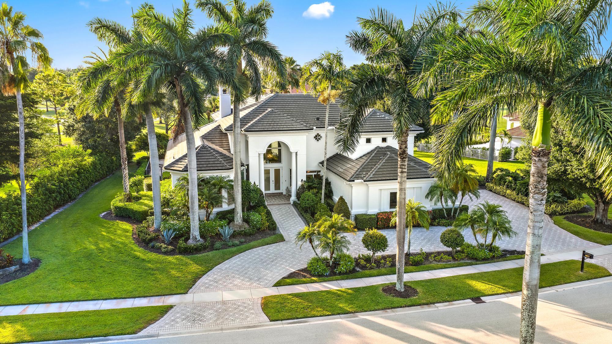Expanded, customized, and RENOVATED 5,000 sq ft Toll Brothers home situated on a premium, oversized half-acre lot with stunning double fairway views. Recent upgrades include a NEW ROOF (2022), THREE NEW LENNOX HVAC units (2023), and TRIPLE-PANE IMPACT WINDOWS AND DOORS (2022).From the moment you enter, you'll be impressed by soaring 23-foot ceilings in the foyer and a dramatic fireplace wall. Newly refinished (2023) gorgeous marble flooring with intricate inlays in the entry and dining areas provides timeless elegance suitable for any decor style. The den features handsome wood floors with decorative inlays as well.Situated on a rare .56-acre lot-and-a-half overlooking the Jack Nicklaus-designed Legend Course, this home offers a versatile floor plan with numerous oversized spaces.