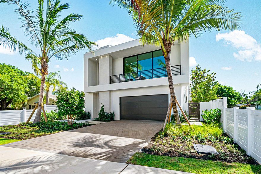 Welcome to Hibiscus House, a curated haven by Stamm Development Group, perfectly situated in one of East Delray's most desirable neighborhoods. This 4-bedroom, 4.5-bath residence offers 3,556 square feet of thoughtfully designed living space, with a total of 4,989 square feet under roof. Every detail of this home has been crafted for seamless indoor-outdoor living, blending sophistication with comfort for both entertaining and relaxation.On the first level, a stunning formal dining room flows effortlessly into the open living area, where floor-to-ceiling sliders invite you to the outdoors. The sleek, neutral-toned gray kitchen--equipped with premium Thermador appliances, including an 8-burner range--caters to the most discerning chef.