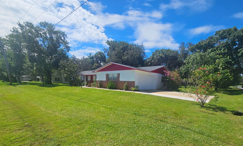 Photo of 1312 Parkland Boulevard, Fort Pierce, FL 34982 (MLS # R11110253)