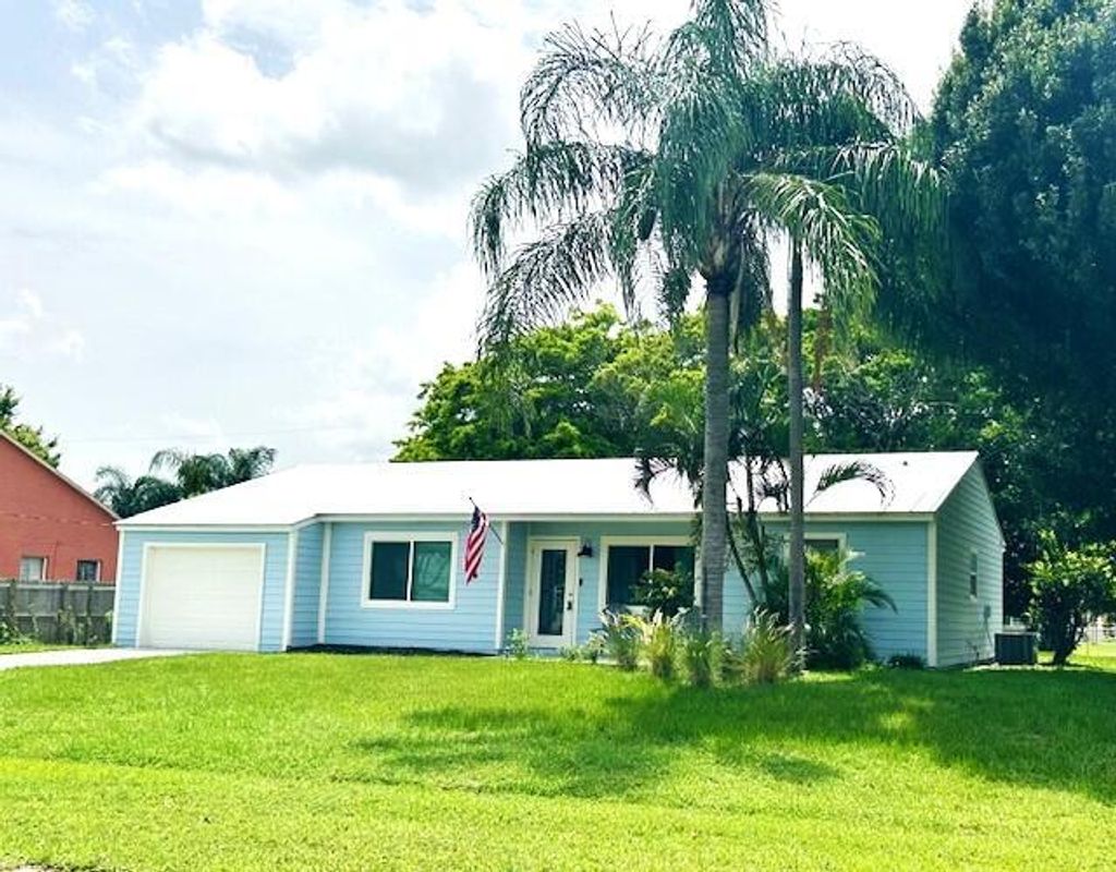 Photo of 1702 SE Duma Terrace, Port Saint Lucie, FL 34952 (MLS # R11002526)