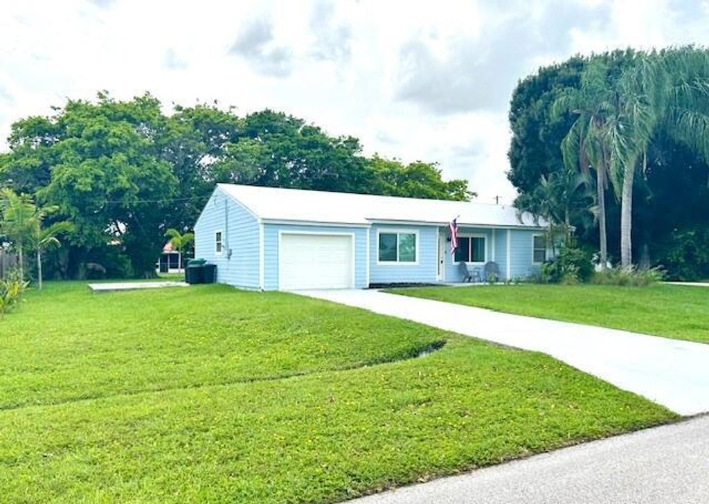 Photo of 1702 SE Duma Terrace, Port Saint Lucie, FL 34952 (MLS # R11002526)