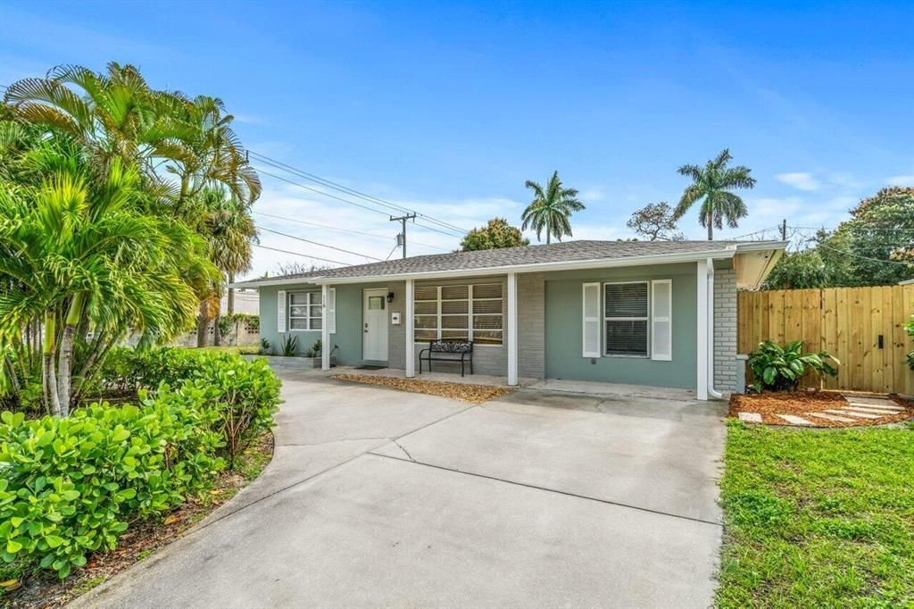 Photo of 118 E Ilex Drive, Lake Park, FL 33403 (MLS # R10783337)