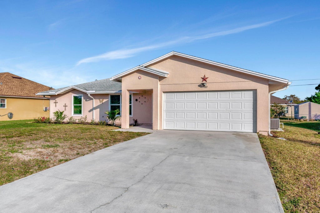 Photo of 481 SW Baoy Avenue, Port Saint Lucie, FL 34953 (MLS # R11067978)