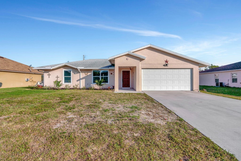 Photo of 481 SW Baoy Avenue, Port Saint Lucie, FL 34953 (MLS # R11067978)