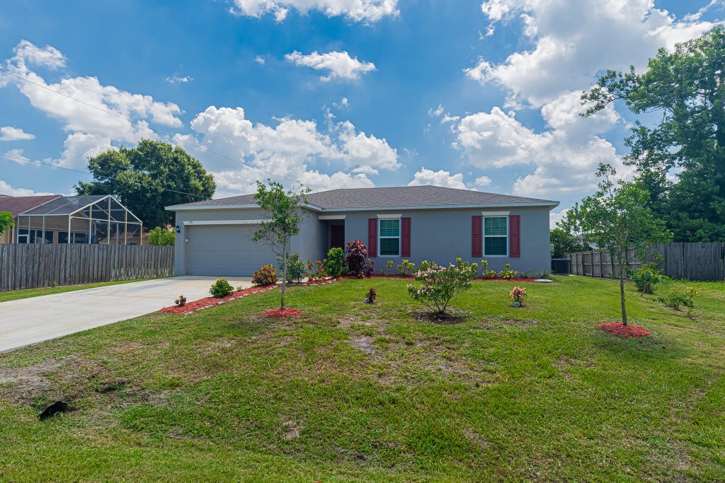 Photo of 1711 SW Angelo Street, Port Saint Lucie, FL 34953 (MLS # B26042780)