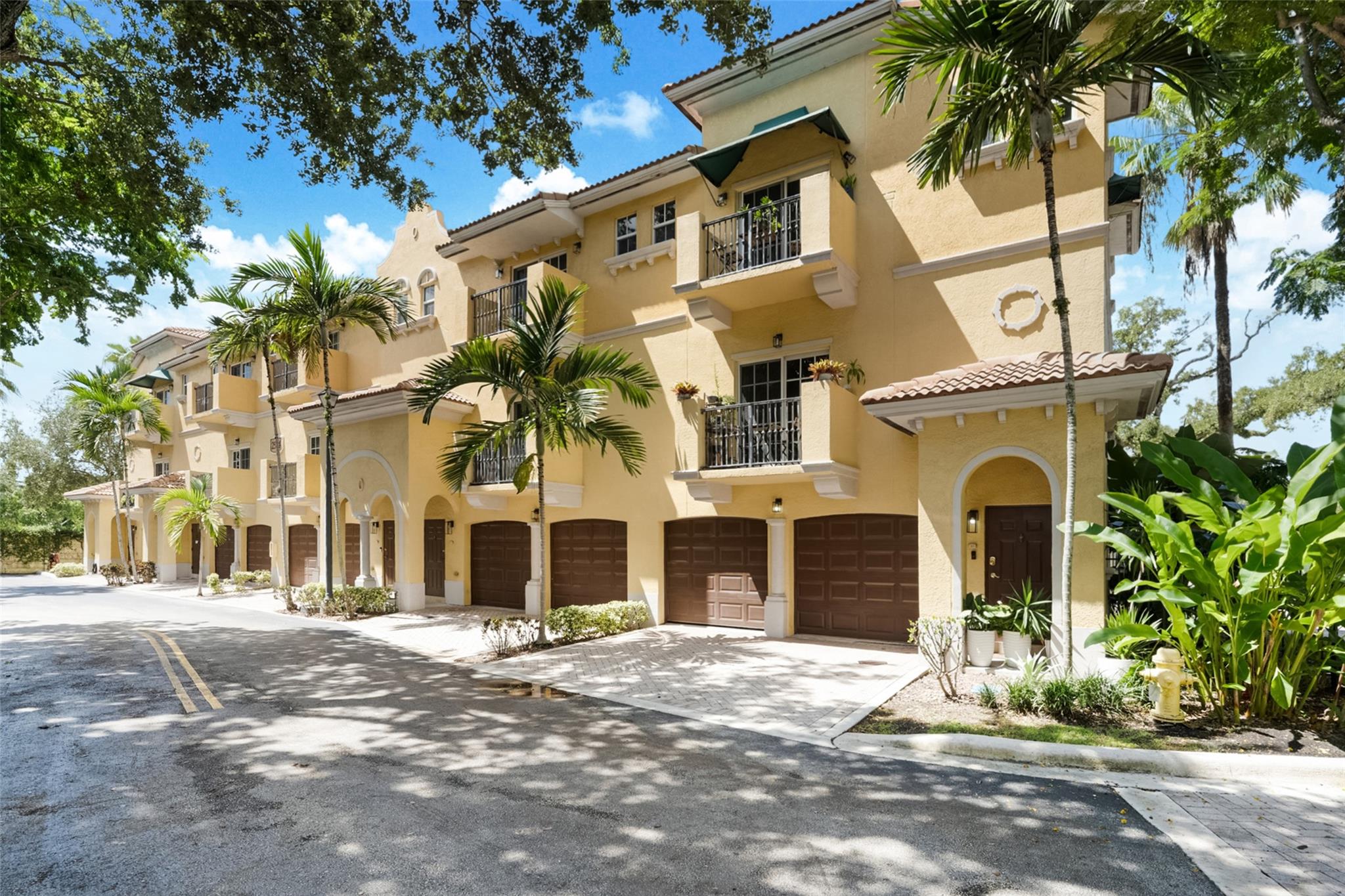 Discover the ideal South Florida corner-unit townhome in the gated community of The Grove at River Oaks. The main level features a bright open layout with a contemporary kitchen, dining area, and half bath. Upstairs, retreat to the spacious primary suite with spa-style bath, vanity, and walk-in closet, plus a generous guest suite with private bath. The attached 2-car garage offers laundry and extra storage. Outside, enjoy your private patio - ideal for morning coffee, unwinding or entertaining. Community amenities include a sparkling pool, with highways, airport, shopping, and dining just minutes away.