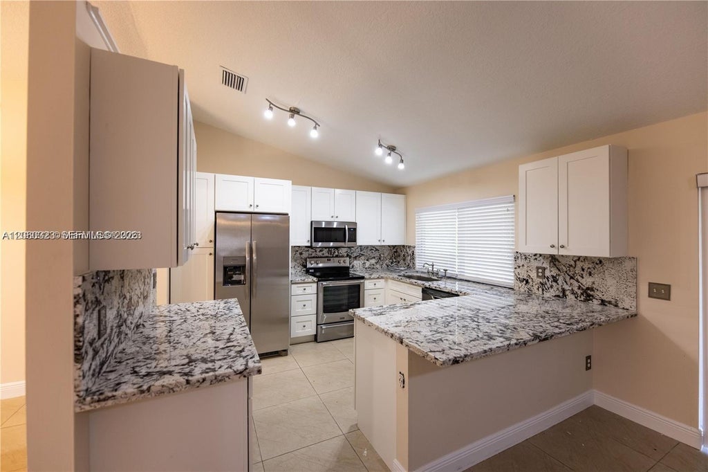 Photo of 9815 NW 43rd Street #0, Sunrise, FL 33351 (MLS # A12060323)