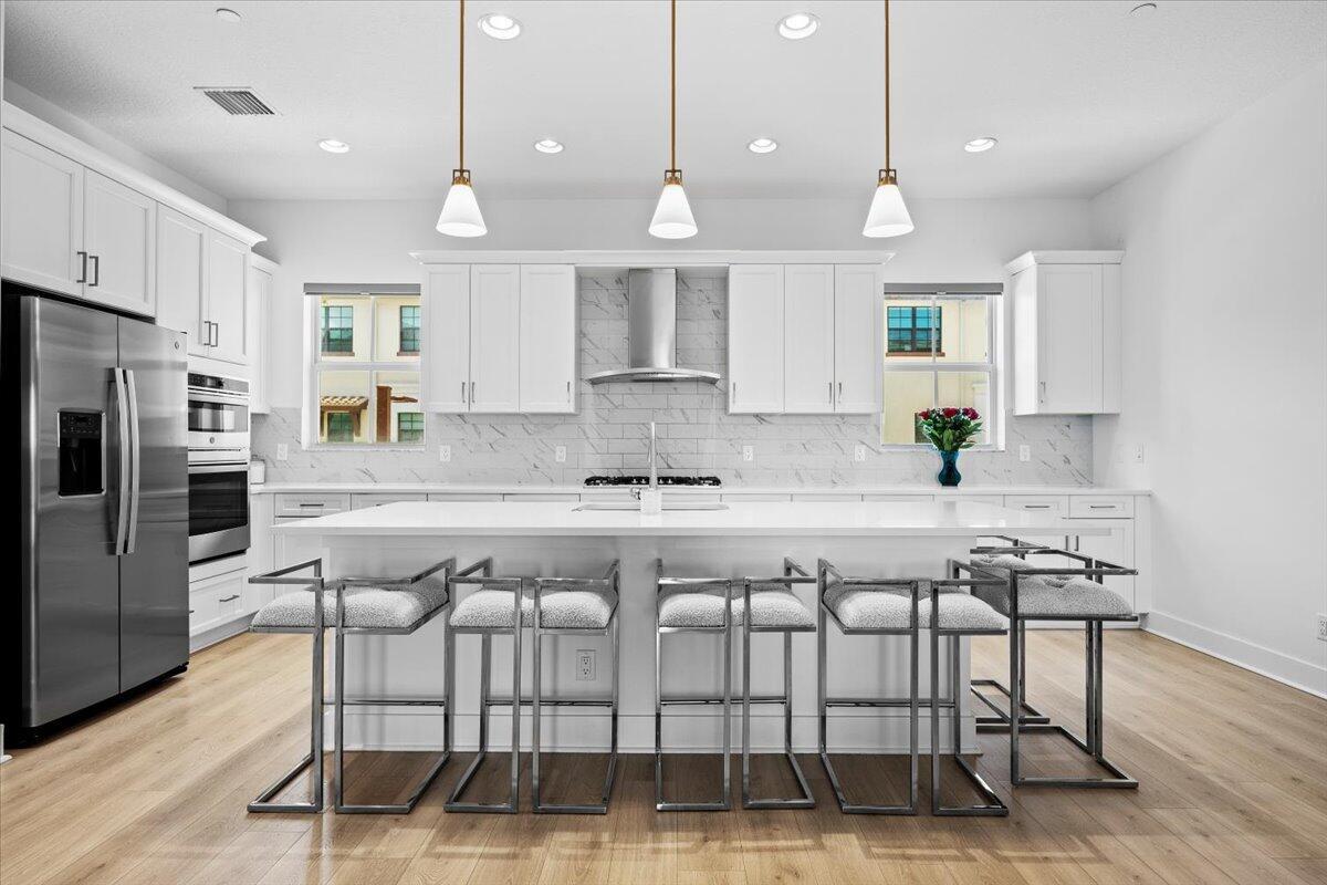 Experience luxury living in this stunning 3-bed, 3.5-bath home in the coveted Alton community. 12689 Machiavelli Way boasts nearly 2,300 sq ft of beautiful space, including a gourmet kitchen with gas cooktop, expansive island, and custom built out closets in every room. Enjoy open-concept living, a spacious primary suite with dual walk-ins, and a covered lanai perfect for entertaining. Complete with a 2 car garage and impact windows, this home offers modern elegance just minutes from top schools, shopping, dining, and the beach. Alton amenities include a resort-style pool, fitness center, pickleball, and more.
