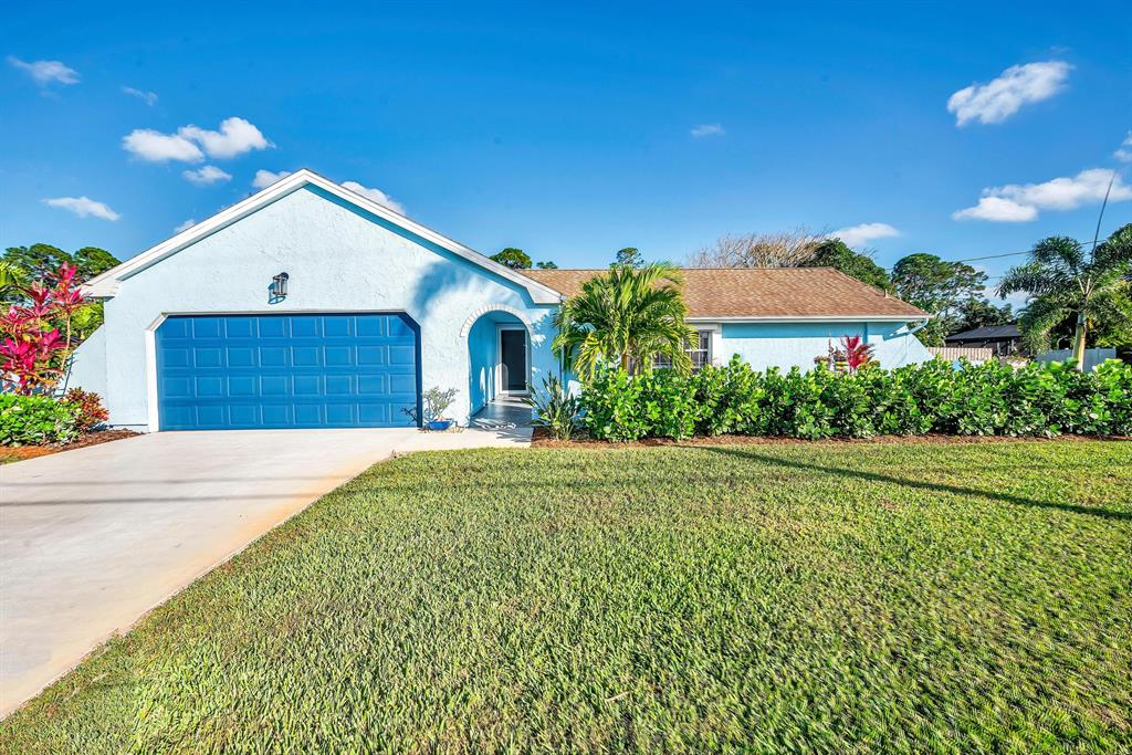 Step inside this immaculate open concept 3 bedroom 2 bathroom split floor plan home situated on just under a half an acre in the desirable Sandpiper area! NEWER ROOF(2015) FENCE(2018) WATER HEATER(2021) TILE ENTRY FLOOR (2022) VINLY FLOOR THROUGHOUT (2018) remodeled kitchen, breakfast bar, eat-in kitchen, granite counter tops, stainless steel appliances, updated pendant lighting, indoor laundry room, accordion shutters, and sprinkler system! This home also features oversized bedrooms, dual vanities with updated mirrors and light fixtures in guest and master baths, a walk in shower with pebble floor in master bath, California style closets and pantry, and a formal dining room.