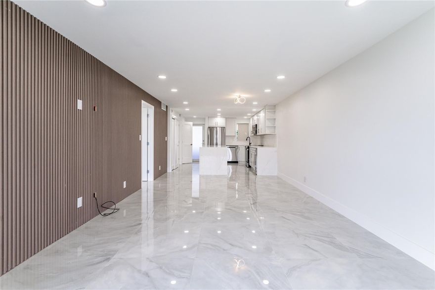 WOW! FULLY RENOVATED LIKE NO OTHER! TOO MANY EXTRA SPECIAL FEATURES TO NAME!  MAGNIFICENT PGA GOLF, TENNIS, POOL & LAKE VIEWS! 4TH Floor 1BR/1.5BA +. WASHER/DRYER. TOTALLY OPEN FLOOR PLAN. Kitchen features SS appliances, granite island & counters, wine cooler, IMPACT WINDOWS/DOOR. Large porcelain floors throughout. Expanded living area w/ enclosed open balcony. Recreation Lease PAID IN FULL! FREE golf (except cart fees) on two 18 hole courses (PGA & Par3); Amenities include Restaurant, Billiard Room, Bbq/Picnic Area, Clubhouse, Courtesy Bus, Exercise Room, Heated Pool, Library, Putting Green, Sauna, Shuffleboard, Tennis, Pickle Ball, Vehicle Wash Area, Electric Car Charging Station. Close to shops, dining & highways. 15 min. to the beach. Association says 55+ age required; BEYOND PERFECT!